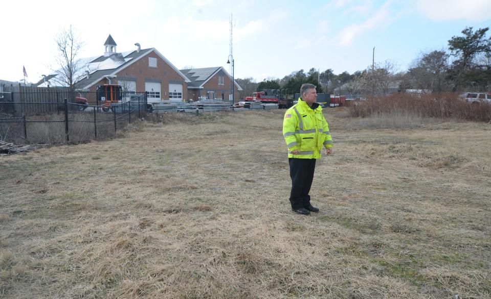 Yarmouth Fire Chief Philip Simonian stands behind Fire Station 3 where the new regional fire training building will be constructed in the spring.