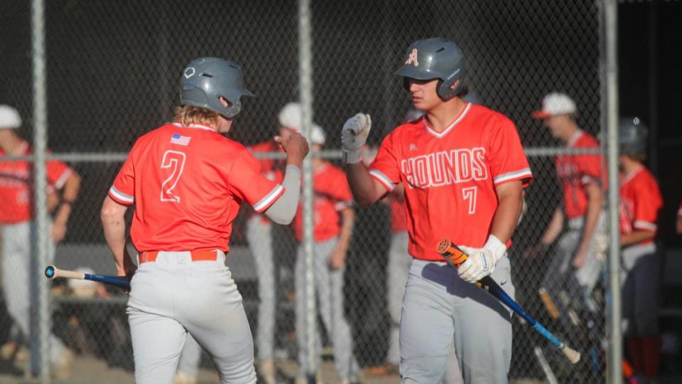 Jarom Damery, left, gets congratulations after scoring from Chase Viale. Atascadero won 8-3 over San Luis Obispo in a baseball game May 3, 2024. Dave Middlecamp