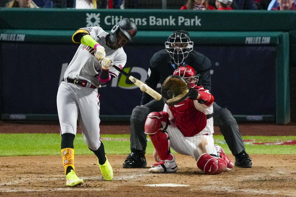 Arizona Diamondbacks' Geraldo Perdomo hits a two-run home run against the Philadelphia Phillies during the sixth inning in Game 1 of the baseball NL Championship Series in Philadelphia, Monday, Oct. 16, 2023. (AP Photo/Matt Rourke)