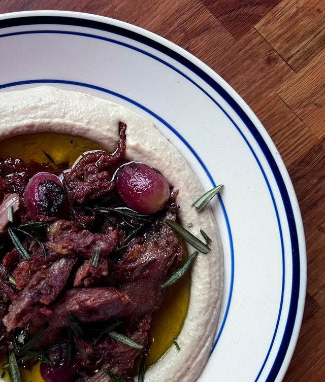 The hummus with duck confit and roasted grapes at Abigail Street, in Over-the-Rhine.