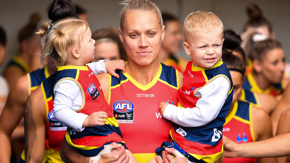 Erin Phillips with her twins before the 2019 AFLW grand final. (Photo by Daniel Kalisz/Getty Images)