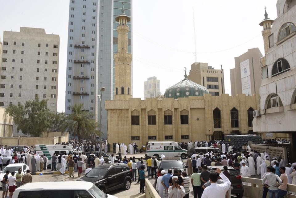 Ambulances park in front of the Imam Sadiq Mosque after a bomb explosion following Friday prayers, in the Al Sawaber area of Kuwait City