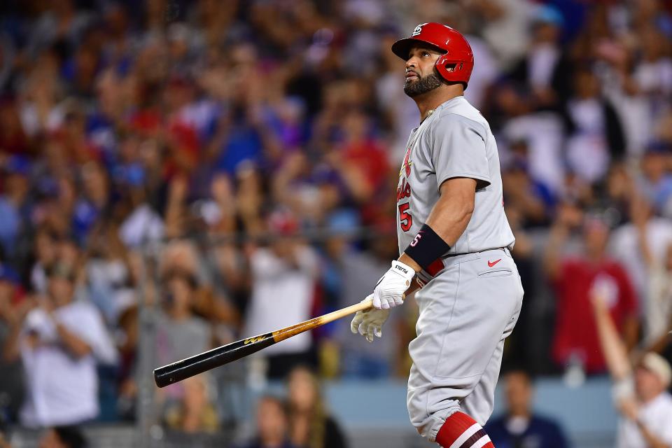 St. Louis Cardinals designated hitter Albert Pujols watches his 700th career home run.