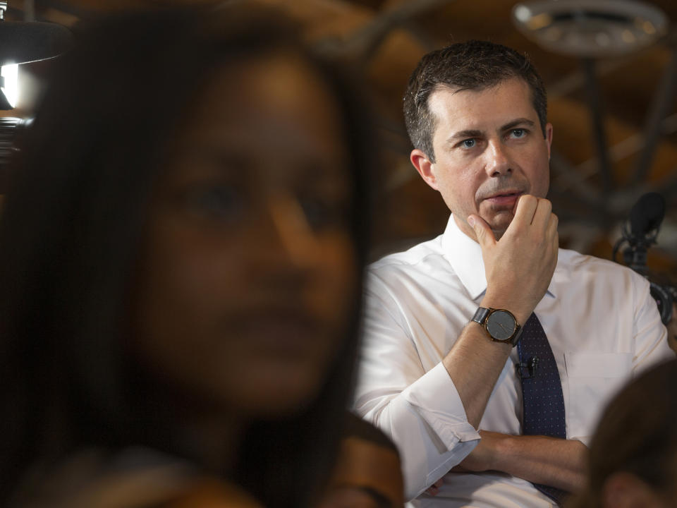 Democratic presidential candidate and South Bend, Ind., Mayor Pete Buttigieg listens to "Dream Hustle Code" students visiting from Chicago, at the Vector90, a coworking space and STEM center created by the late Nipsey Hussle, in Los Angeles, Thursday, July 25, 2019. (AP Photo/Damian Dovarganes)