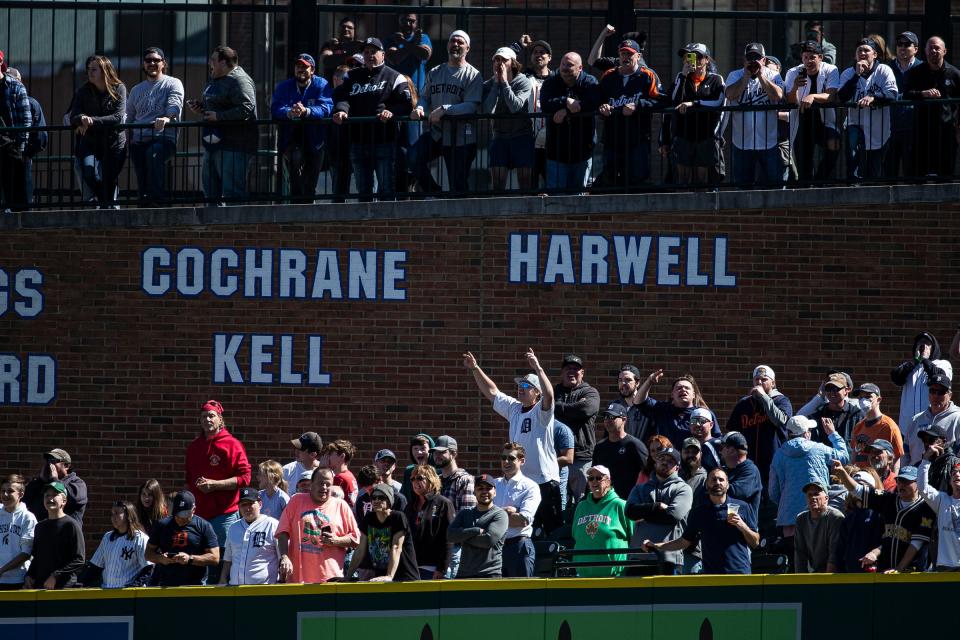 Detroit Tigers fans react after Miguel Cabrera gets intentionally walked by the New York Yankees during the eighth inning at Comerica Park on Thursday, April 21, 2022.