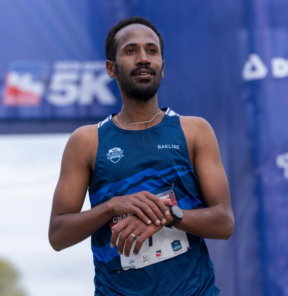 Futsum Zienasellassie comes across in second place on the Mini Marathon course, Saturday, May 7, 2022. 