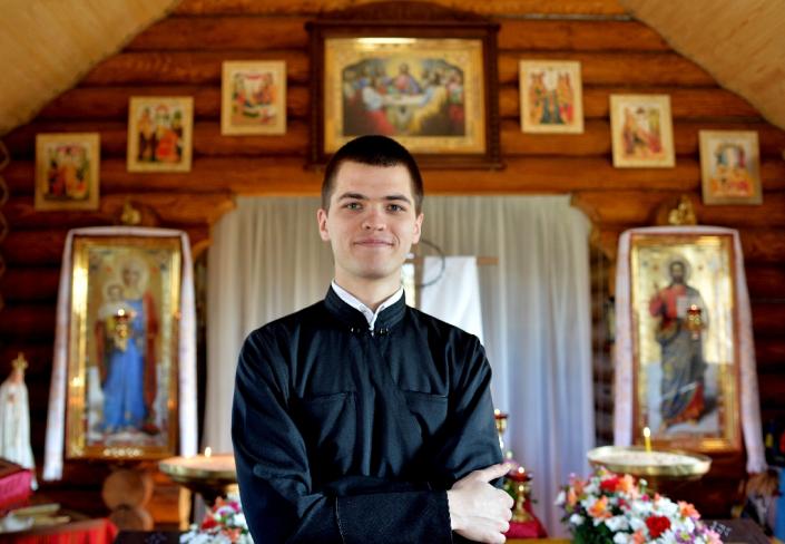 Seminarian Oleg, 21, poses for a photograph on April 11, 2015 in the small wooden chapel above the Maidan, the scene of deadly protests in 2014 that shaped Ukraine's history (AFP Photo/Genya Savilov)