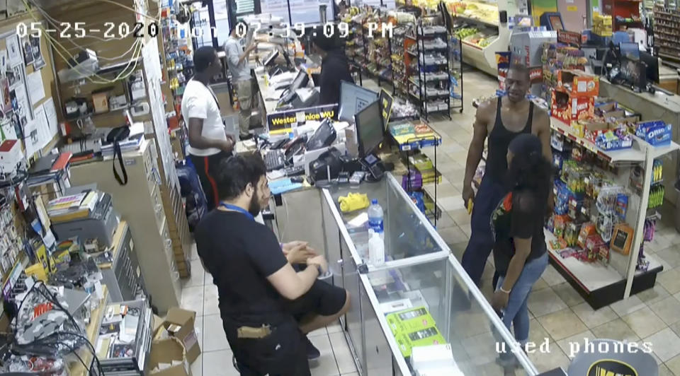 In this image from store video, George Floyd, right, is seen inside Cup Foods on May 25, 2020, in Minneapolis.  Former Minneapolis Police officer Derek Chauvin is on trial for the death of Floyd at the Hennepin County Courthouse in Minneapolis, Minn. (Court TV via AP, Pool)