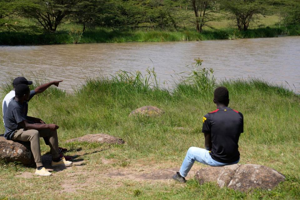 A local person points where Anthony Shungea Pasha who was thoroughly dismembered by hyenas (AP)