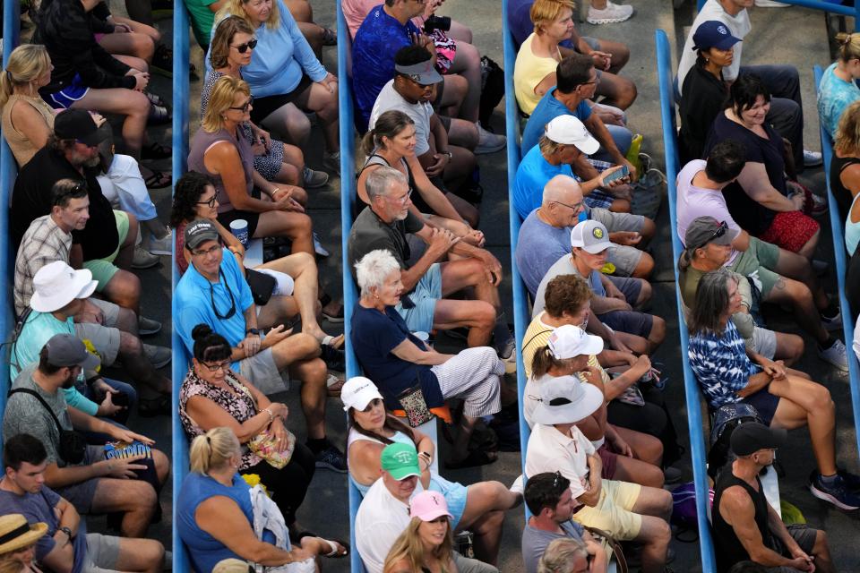 Tennis fans watch the match between Ann Li, of the United States, and Aryna Sabalenka, of Russia, during their match of the Western & Southern Open tennis tournament in August.