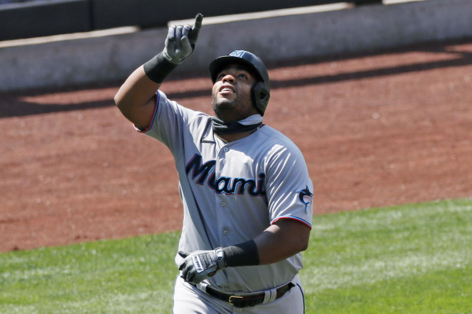 Miami Marlin's first baseman Jesus Aguilar points skyward as he trots the bases after hitting a solo home run during the fifth inning of a baseball game against the New York Mets at Citi Field, Sunday, Aug. 9, 2020, in New York. (AP Photo/Kathy Willens)