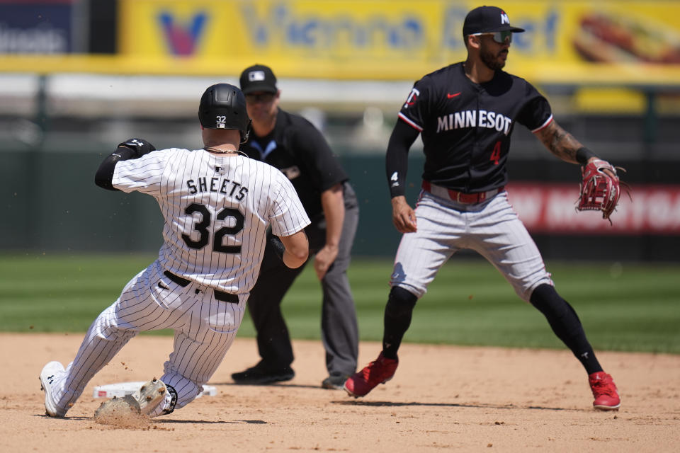 Chicago White Sox's Gavin Sheets slides into second on a double before Minnesota Twins shortstop Carlos Correa can tag him during the fifth inning of a baseball game against the Minnesota Twins, Wednesday, July 10, 2024, in Chicago. (AP Photo/Erin Hooley)