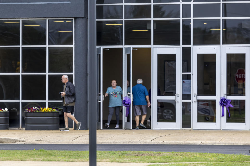 Voters enter and exit at Tuscaloosa County Ward 21 Northport City Hall, during a primary election, Tuesday, March 5, 2024, in Northport, Ala. Fifteen states and a U.S. territory hold their 2024 nominating contests on Super Tuesday this year. (AP Photo/Vasha Hunt)