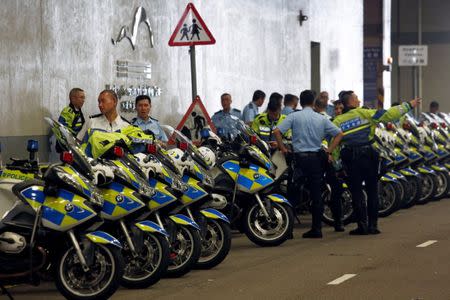 Police escort team patrol at the Hong Kong Convention and Exhibition Centre, where Chinese President Xi Jinping will attend a swearing-in ceremony of the new chief executive, five days before the territory celebrates the 20th anniversary of its handover to Chinese rule, in Hong Kong, China June 26, 2017. REUTERS/Bobby Yip