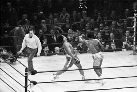 Joe Frazier (R) lands a left hook on Muhammad Ali during the first of their three epic battles at Madison Square Garden in New York City, New York, U.S. March 8, 1971. Mandatory Credit: Action Images / MSI/Files