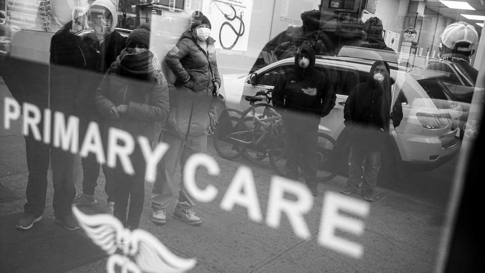 Patients wait inside an urgent care pharmacy while wearing personal protective equipment, Wednesday, March 25, 2020, in the Queens borough of New York. Gov. (John Minchillo/AP)