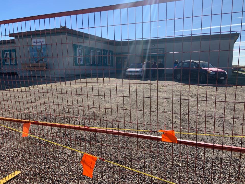 Through a gate built around the property, several people believed to be followers of Didulo were pictured standing outside the old school building on Saturday at the protest.