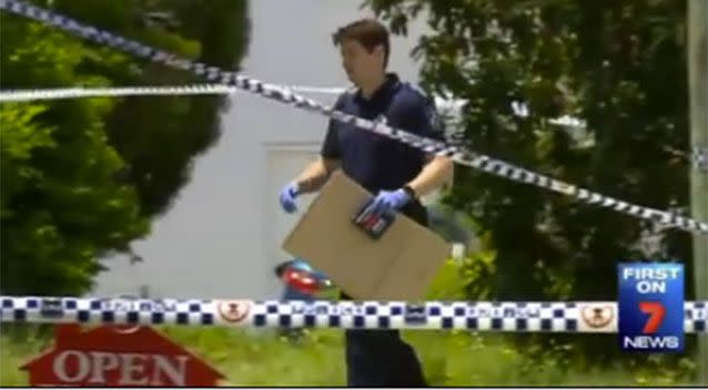 Investigators outside the house yesterday. Source: 7 News.