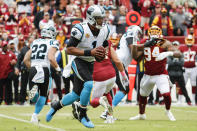 Carolina Panthers quarterback Cam Newton (1) scrambles with the ball during the first half of an NFL football game against the Washington Redskins, Sunday, Oct. 14, 2018, in Landover, Md. (AP Photo/Pablo Martinez Monsivais)