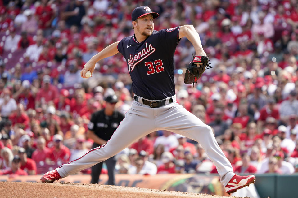 Washington Nationals starting pitcher Erick Fedde (32) throws during the first inning of a baseball game against the Cincinnati Reds, Saturday, June 4, 2022, in Cincinnati. (AP Photo/Jeff Dean)