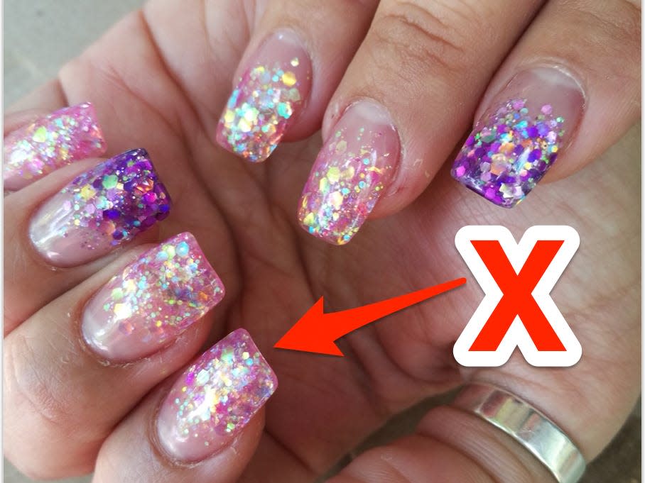 An 'X' pointing at glitter-gel nails.