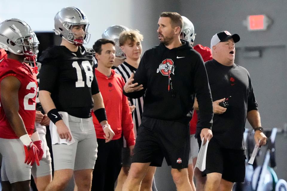 Mar 5, 2024; Columbus, OH, USA; Ohio State Buckeyes offensive coordinator Brian Hartline talks to quarterback Will Howard (18) during the first spring practice at the Woody Hayes Athletic Center.