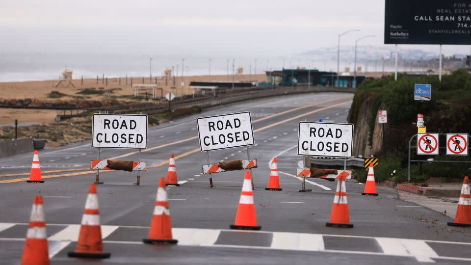A section of the Pacific Coastal Highway closed Thursday from flooding during a rain storm in Bolsa Chica, near Huntington Beach, California. - David Swanson/AFP/Getty Images
