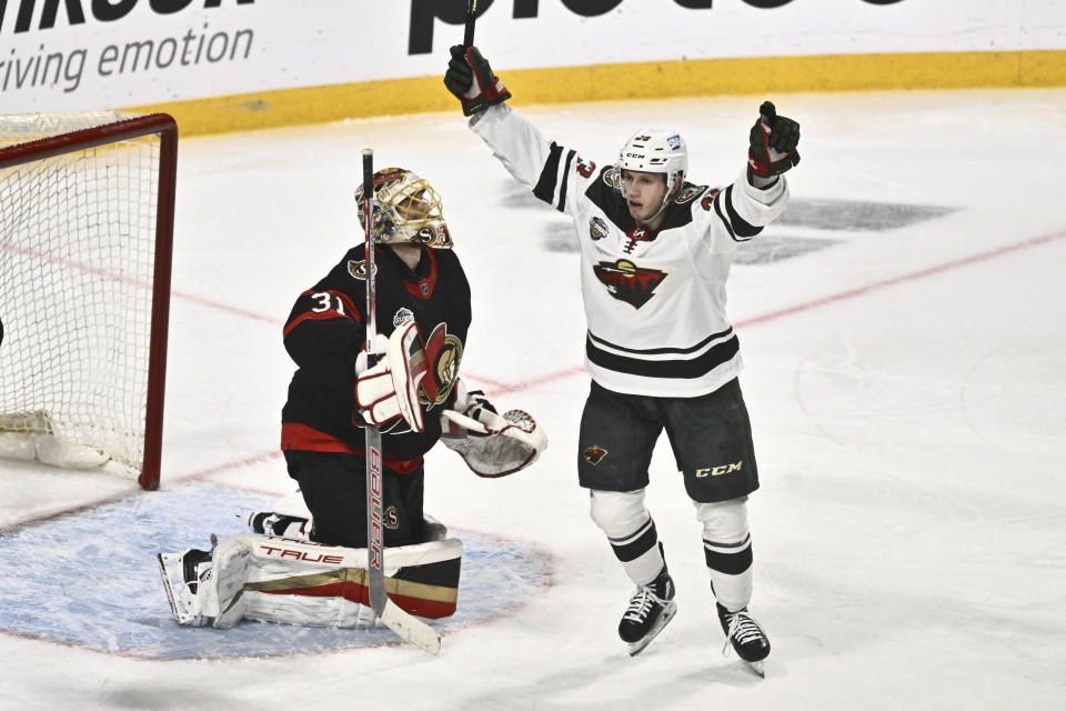 Minnesotas Marco Rossi, right, celebrates after scoring as Ottawas goalkeeper Anton Forsberg, left, looks on during the NHL Global Series Sweden ice hockey match between Minnesota Wild and Ottawa Senators at Avicii Arena in Stockholm, Sweden, Saturday, Nov. 18, 2023. (Claudio Bresciani/TT News Agency via AP)