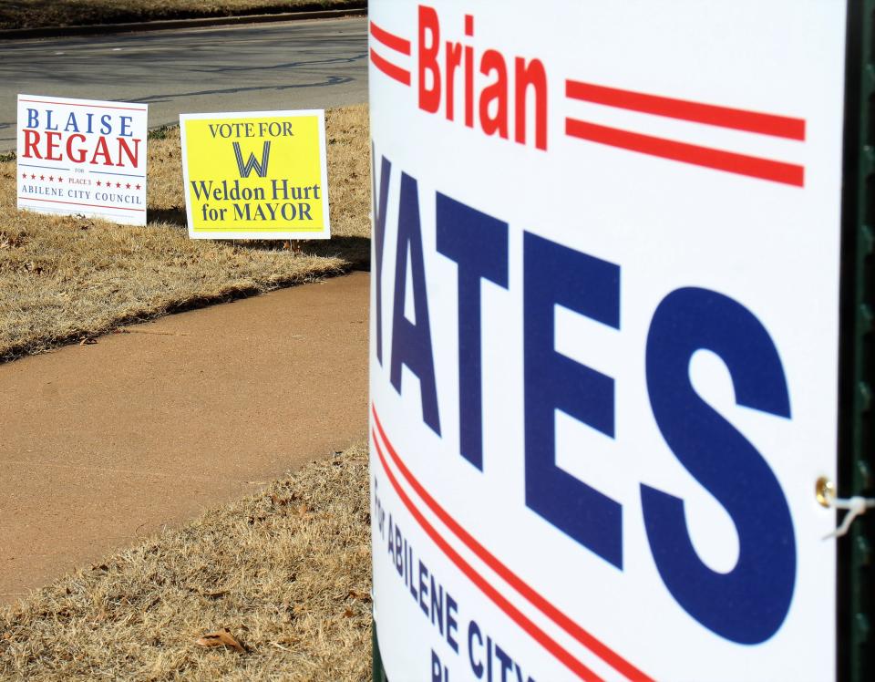 A grouping of campaign signs support Abilene City Council candidates Blaise Regan and Brian Yates, along with current councilman Weldon Hurt, who is running for mayor. The three in campaign announcements promoted Abilene business.