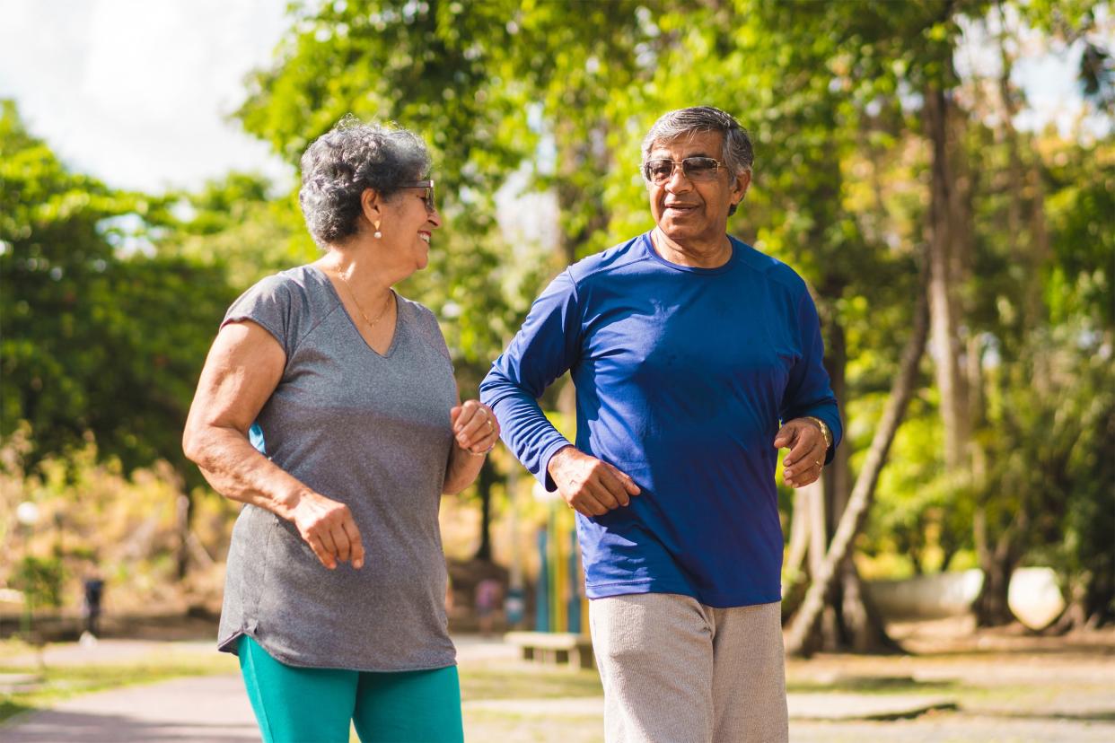 Older couple walking outside