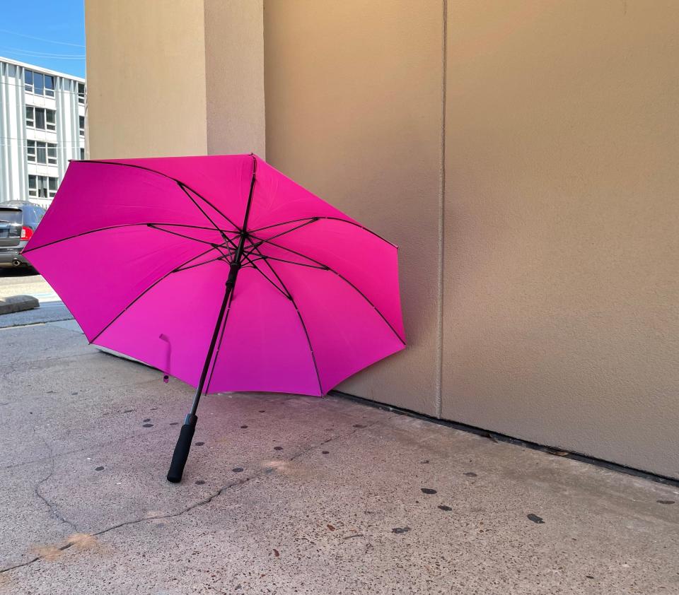 Emily Berisso, a longtime volunteer for Planned Parenthood, escorts people inside the Memphis clinic wearing a pink vest and shielding them with a pink umbrella, photographed here at the corner of her post outside the building on Friday, June 24, 2022, shortly after the Supreme Court ruled Americans no longer have a constitutional right to abortion.