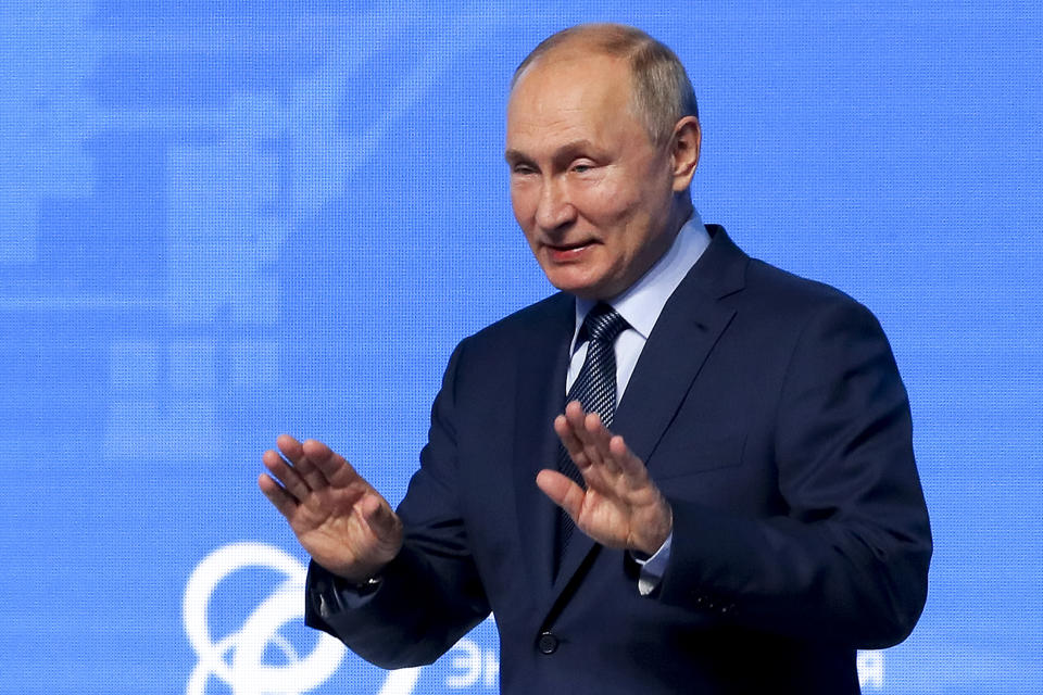 Russian President Vladimir Putin gestures as he arrives to attend the plenary session of the Russian Energy Week in Moscow, Russia, Wednesday, Oct. 13, 2021. (Sergei Ilnitsky/Pool Photo via AP)