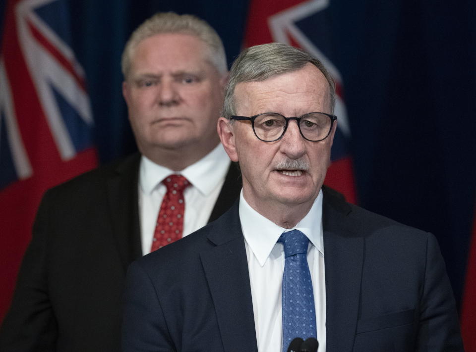 Ontario Premier Doug Ford listens as Ontario Chief Medical Officer of Health Dr. David Williams answers questions during a news conference at the Ontario Legislature in Toronto in March 2020. (Credit: Canadian Press/Frank Gunn)