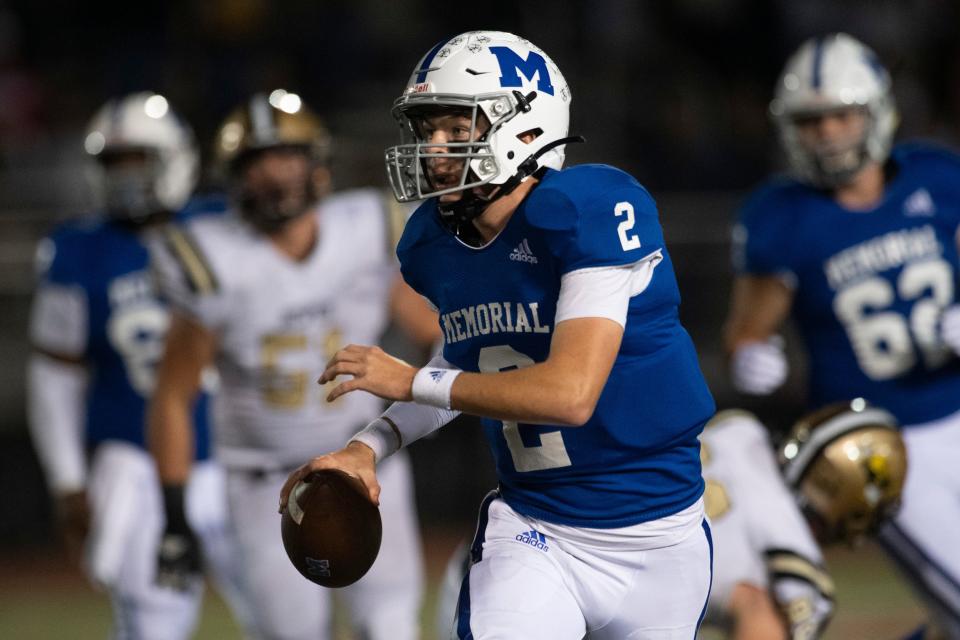 Memorial’s Matthew Fisher (2) looks to pass the ball as the Memorial Tigers play the Jasper Wildcats in the Class 4A sectional semifinal game at Enlow Field in Evansville, Ind., Friday, Oct. 28, 2022. 