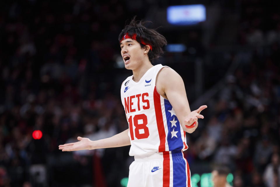 Brooklyn Nets forward Yuta Watanabe (18) reacts during the second half of of an NBA basketball game against the Toronto Raptors in Toronto, Friday, Dec. 16, 2022. (Cole Burston/The Canadian Press via AP)