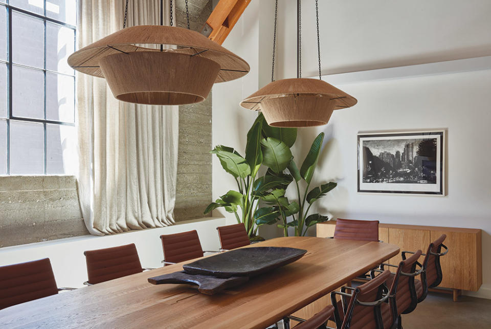 Nickey Kehoe’s String Lantern pendants bring warmth to the conference room, which also features Eames’ Management chairs in burgundy and designer Solis’ Galerie Solis table (from her soon-to-launch handcrafted furniture line).