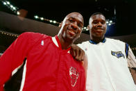 Michael Jordan poses with rookie Shaquille O'Neal before the Bulls faced the Orlando Magic in a 1993 regular-season game. Jordan scored 64 points in his first meeting with O'Neal. (Getty Images)