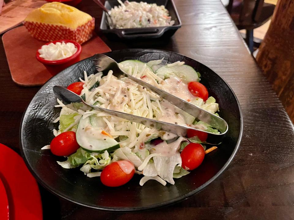 Hoop-De-Doo Revue at Disney - a large salad bowl with tongs on top