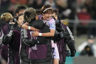 Japan's Hinata Miyazawa celebrates with coaches after Norways scored the opening own goal during the Women's World Cup second round soccer match between Japan and Norway in Wellington, New Zealand, Saturday, Aug. 5, 2023. (AP Photo/Alessandra Tarantino)