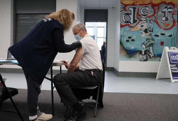 PHOTO: In this April 28, 2022, file photo, Governor Charlie Baker receives his second Pfizer COVID-19 Vaccine Booster from a nurse at a vaccine site set up at the Melnea A. Cass Recreational Complex in Boston. (Jessica Rinaldi/The Boston Globe via Getty Images, FILE)
