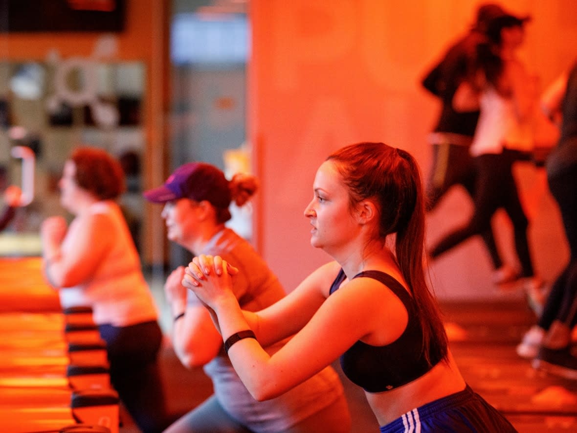Patrons of Orangetheory Fitness in Toronto’s Fort York neighbourhood take a class on Oct. 25, 2021. The company has four studios in Saskatchewan, two in Saskatoon and two in Regina. (Evan Mitsui/CBC - image credit)