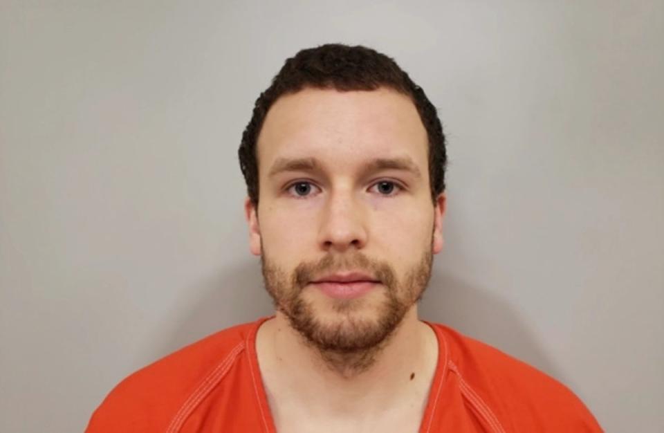 Levi Axtell, 27, (pictured in mugshot) allegedly beat Lawrence Scully, 77, more than a dozen times with a shovel before he ‘finished’ him off with the large pair of antlers (Cook County Sheriff’s Office)