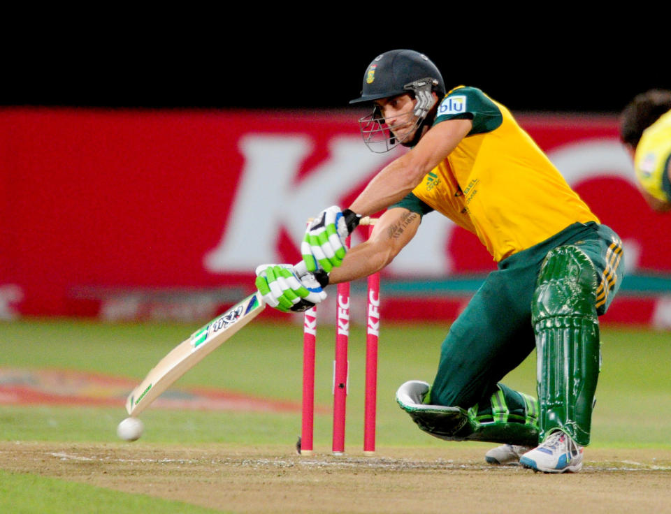 In this photo taken Wednesday, March 12, 2014, South Africa's Faf du Plessis bats at the wicket during their rain-delayed T20 cricket match against Australia in Durban, South Africa. (AP Photo)