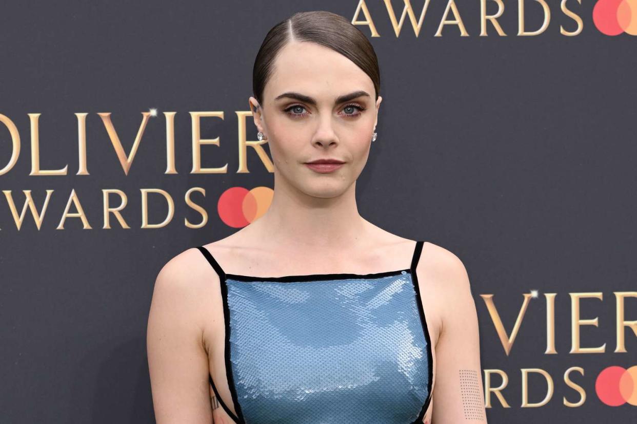 <p>Karwai Tang/WireImage</p> Cara Delevingne attends The Olivier Awards 2024 on April 14, 2024 in London, England. 