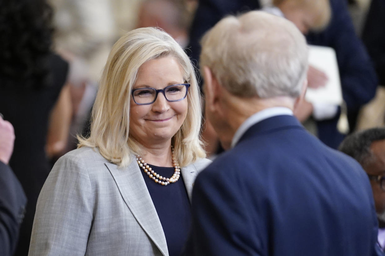 FILE - Rep. Liz Cheney, R-Wyo., talks with former Sen. Joe Lieberman in the East Room before President Joe Biden awards the Presidential Medal of Freedom, to 17 people at the White House in Washington, Thursday, July 7, 2022. Former congresswoman Cheney will give a graduation speech Sunday, May 28, 2023, at Colorado College, a Colorado liberal arts college that is her alma mater, amid questions about her political future and promise to prevent Donald Trump from becoming president again. (AP Photo/J. Scott Applewhite, File)