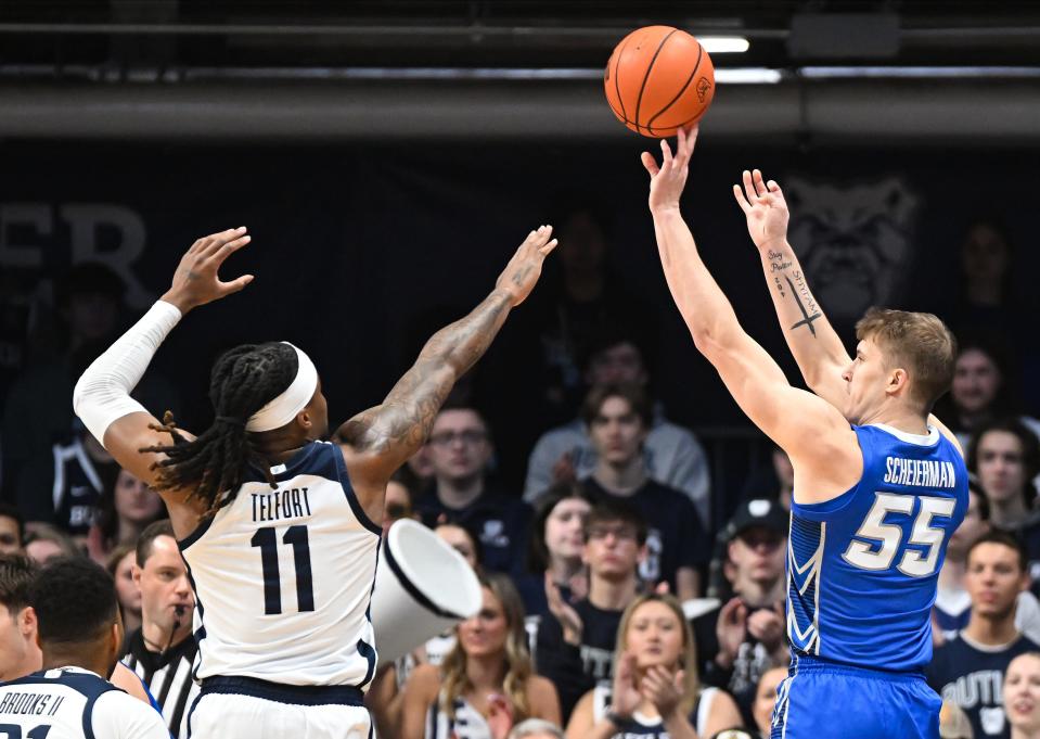 Feb 17, 2024; Indianapolis, Indiana, USA; Creighton Bluejays guard Baylor Scheierman (55) attempts a shot over Butler Bulldogs guard Jahmyl Telfort (11) during the first half at Hinkle Fieldhouse. Mandatory Credit: Robert Goddin-USA TODAY Sports