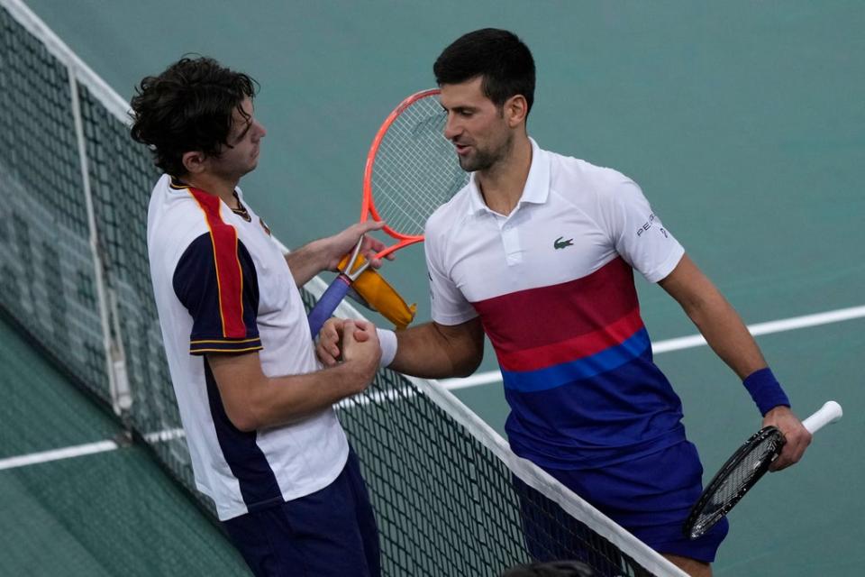 Novak Djokovic (right) advanced to the Paris Masters semi-finals with victory over Taylor Fritz (Francois Mori/AP) (AP)