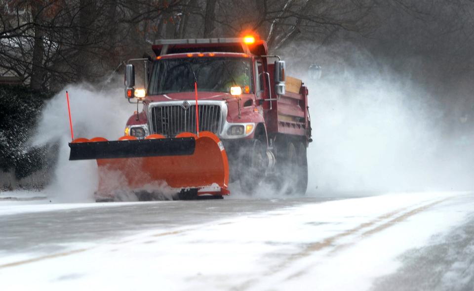 A snow removal vehicle clears snow off West Lawrence Ave. Thursday Dec. 22, 2022.
