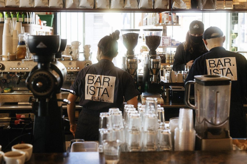 ST. ALi baristas are seen making coffee at their Melbourne cafe. The company had offered Covid RATs to customers making large online orders.