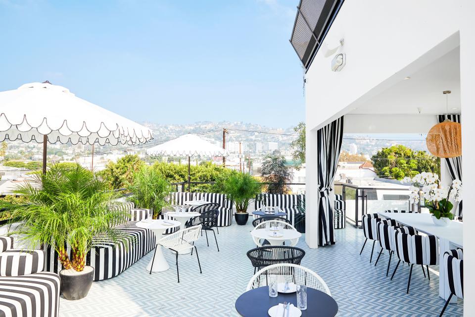 Striped seating enlivens the rooftop terrace.